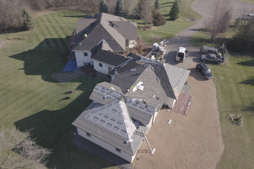 Drone shot of a residential roofing installation/replacement by WeatherTek Exteriors.